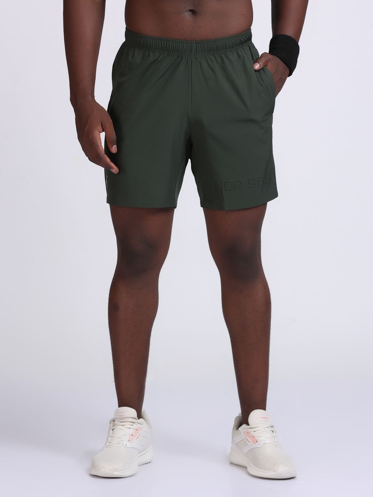 Front view of olive green athletic Feather LaserTech shorts with elastic waistband.