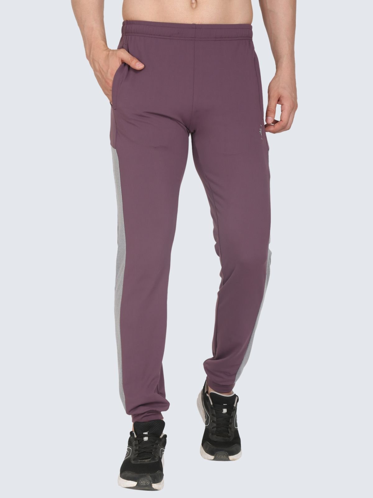 Front waist-to-ankle view of TrackPant Ankel Ribbed Prussian plum jogger pants with grey side panel on a white background
