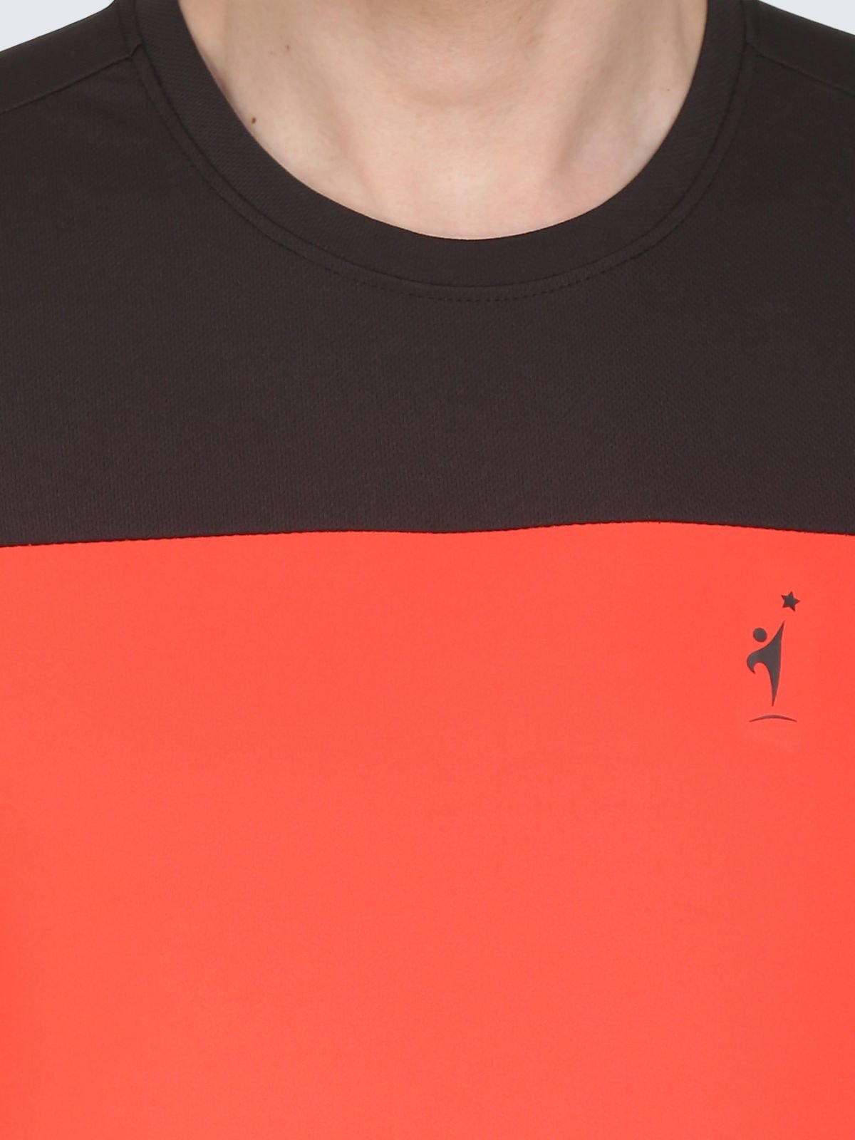 Close-up of tomato red ClubSpirit T-shirt showing black yoke and chest NDR SPORT logo