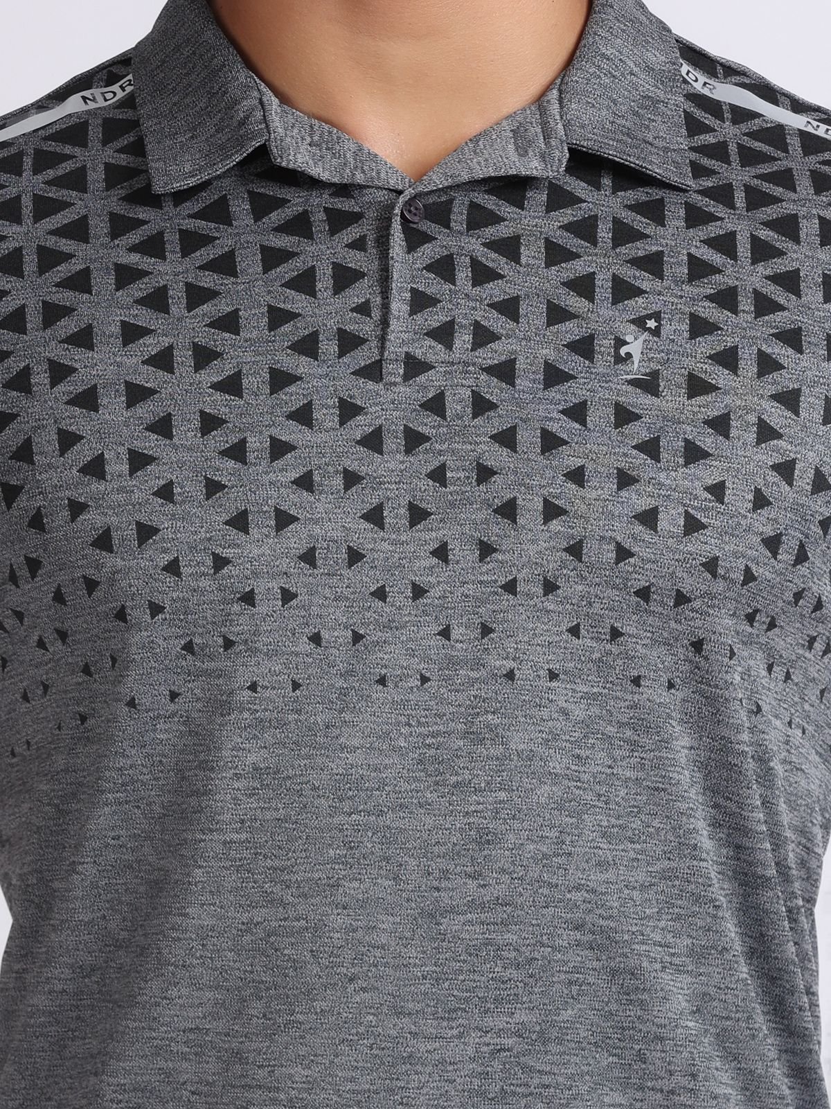 Close-up of dark grey polo T-shirt Milanz Illustrated with triangle geometric print and small chest brand logo of NDR SPORT in India