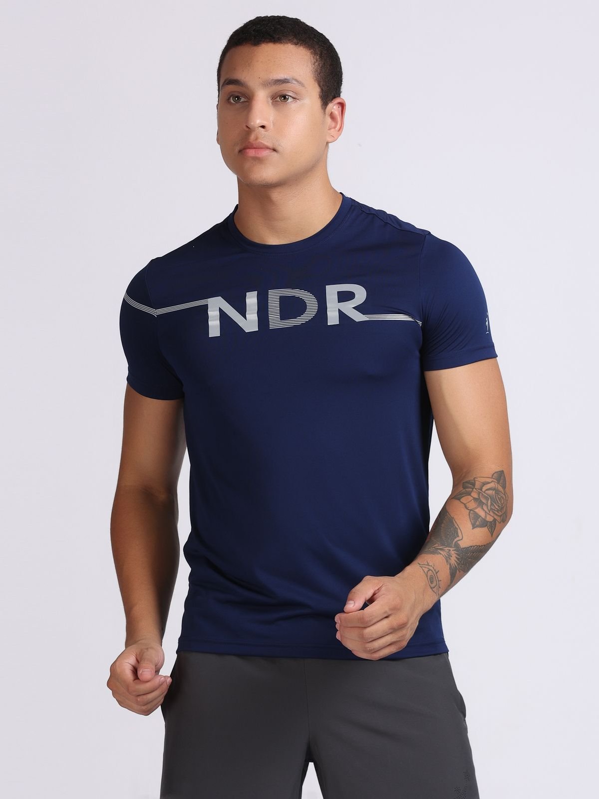 Front view of a man wearing a navy NDR Blitz t-shirt.