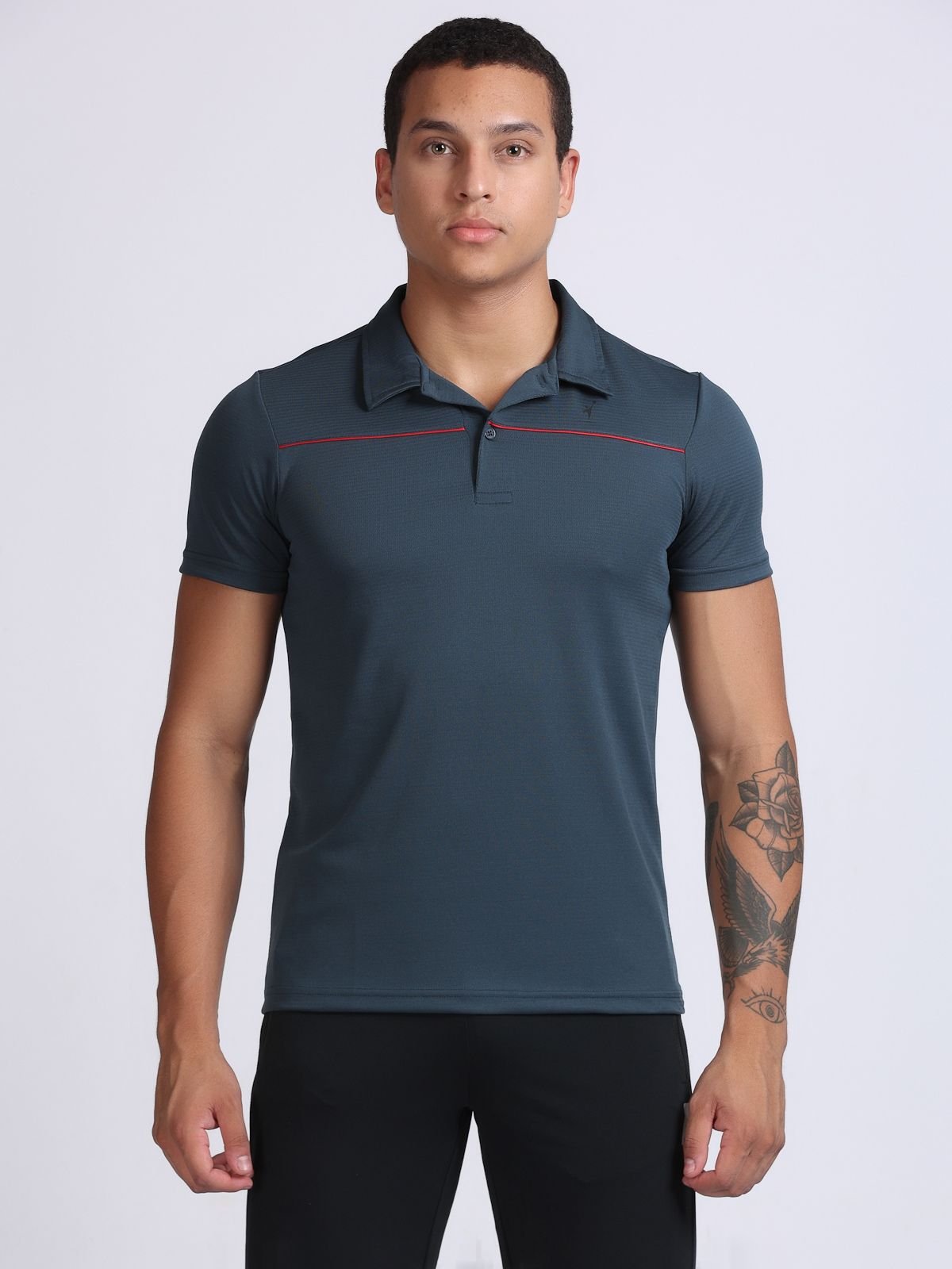 Front view of a dark grey sport polo tshirt with red piping across the chest.