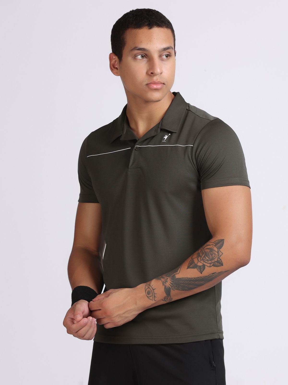 Male model wearing olive green sport polo, left-facing view