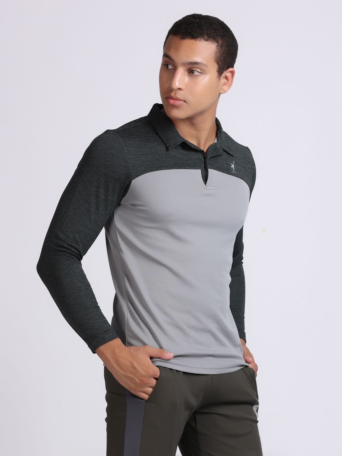 Three-quarter view of a light grey and dark grey long-sleeve polo T-shirt SwanTech athletic top from the right.