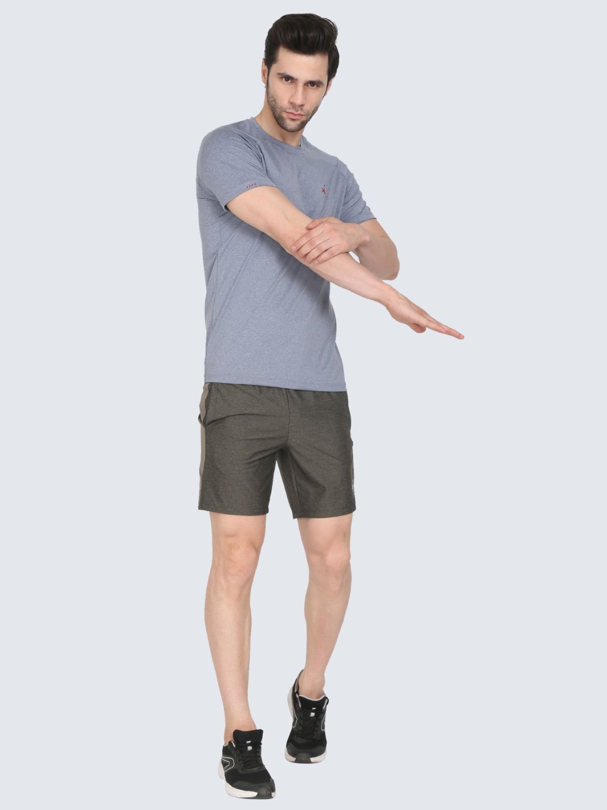 Full-body male model in grey cool n comfort tee wearing olive athletic Regular Strips shorts on a white background