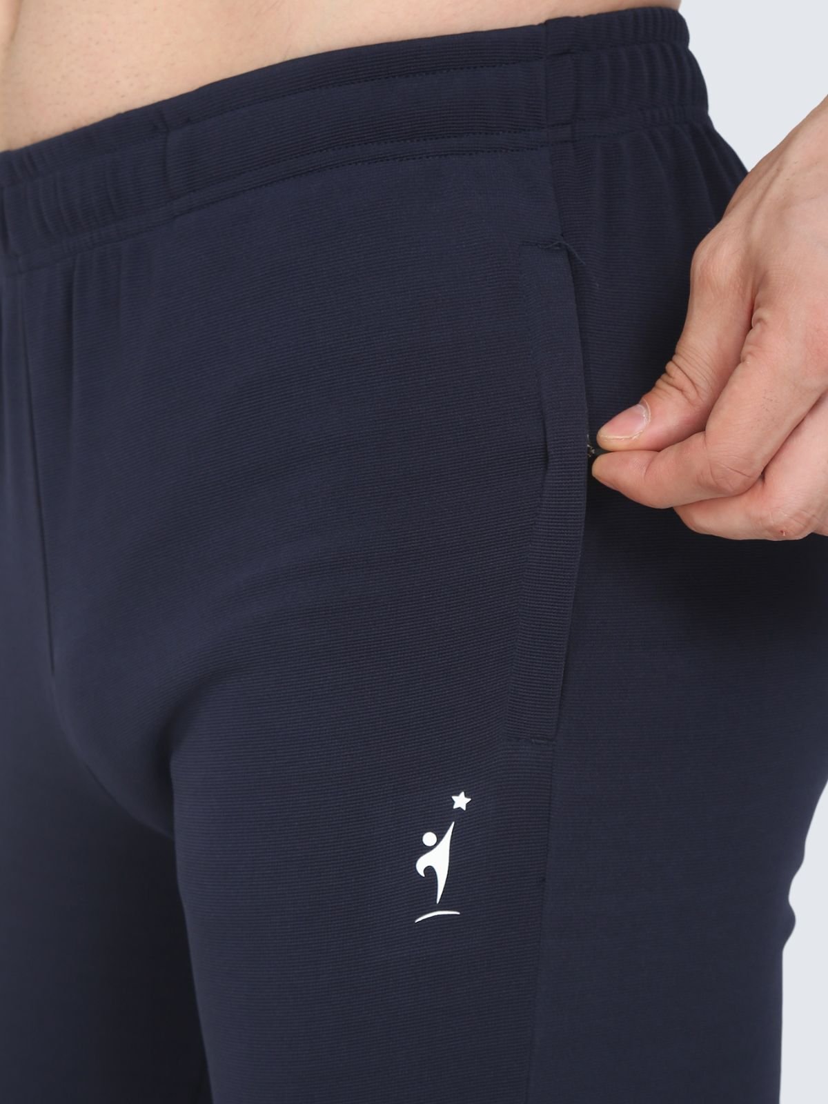 Close-up of zip pocket on navy Regular stretch athletic pants with NDR SPORT logo
